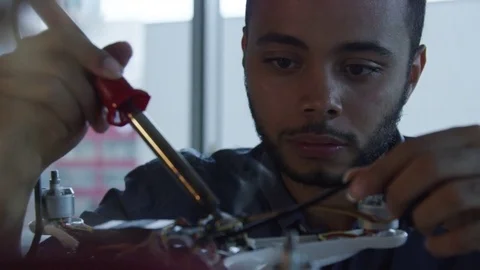 Engineering student building a robot in Sillicone Valley Stock Footage 82372037