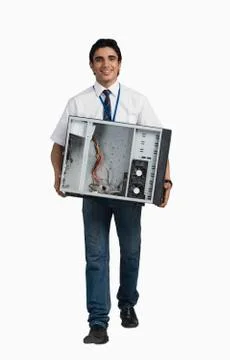 Engineering student carrying a computer cabinet Stockfoto's