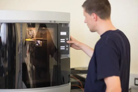 Engineering student using 3d printer Stock Photos