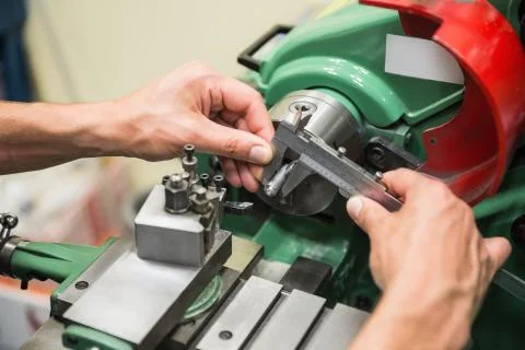 Engineering student using heavy machinery 스톡 사진