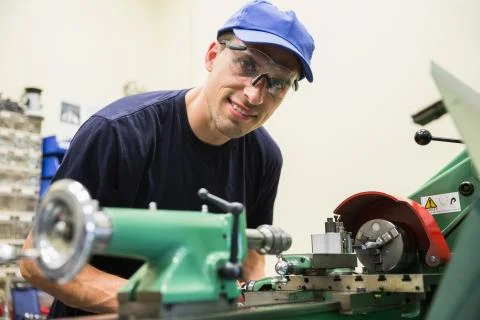 Engineering student using heavy machinery 스톡 사진