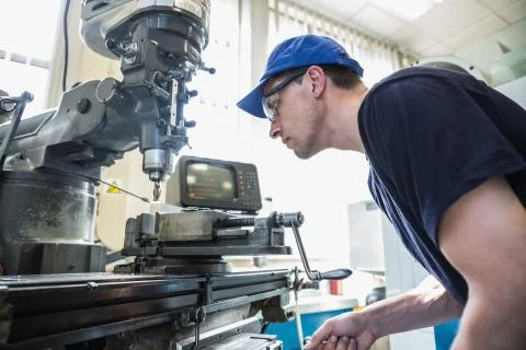 Engineering student using large drill 스톡 사진
