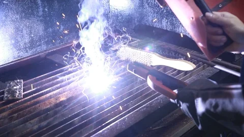 An engineering student welding a piece of metal - Slow Motion 1 Stock-Footage 97985274