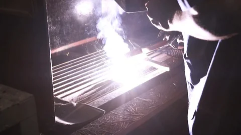 An engineering student welding a piece of metal - Slow Motion 2 Stock-Footage 97985937