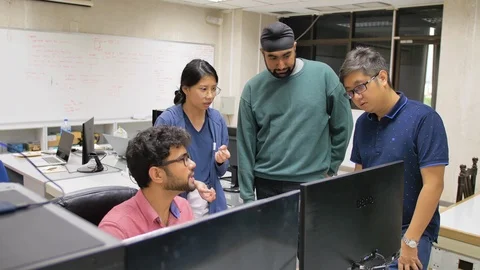 Engineering Students Communicating on a Class Project. Stock Footage 119943728