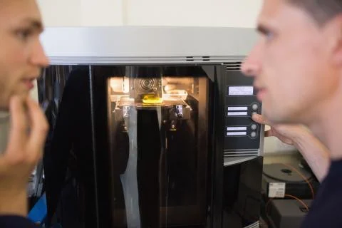 Engineering students using 3d printer Stock Photos