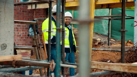 Engineering, team and walk on construction site with inspection, tablet or Stock Footage 336189557
