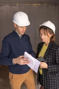 Engineering team of architects and construction workers wearing hard hats, .. Fotos de archivo
