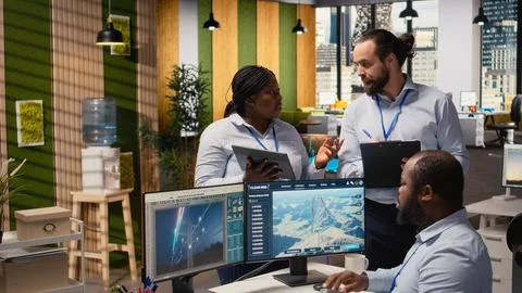 Engineering team brainstorming futuristic wind turbine concept Stock Photos
