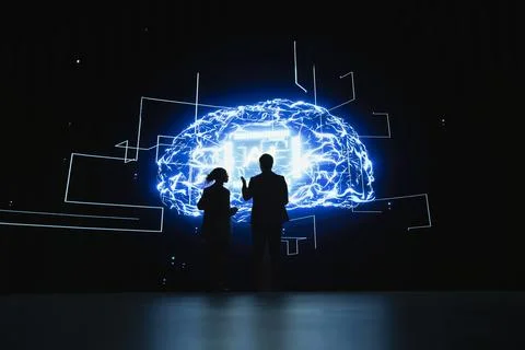 Engineering team completes assignments distributed by AI agent, working together Stock Photos