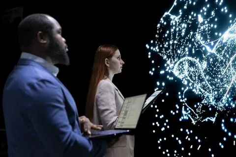 Engineering team coworkers modifying AI neural network structure 스톡 사진