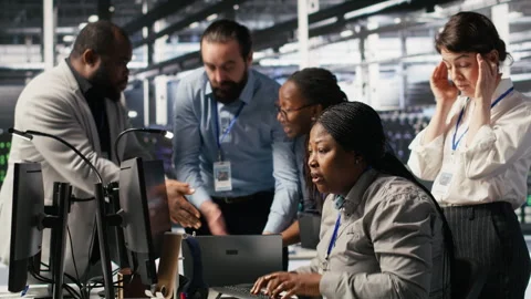 Engineering team in data center panicking after receiving critical error popup Stock Footage 309375938