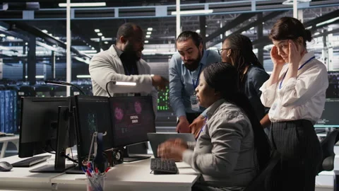 Engineering team in data center panicking after receiving critical error popup Stock Footage 309790536
