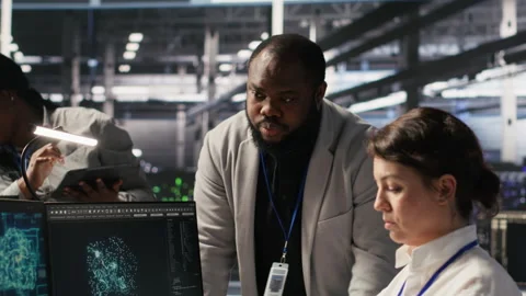 Engineering team in data center using AI automation Video stock 309396170