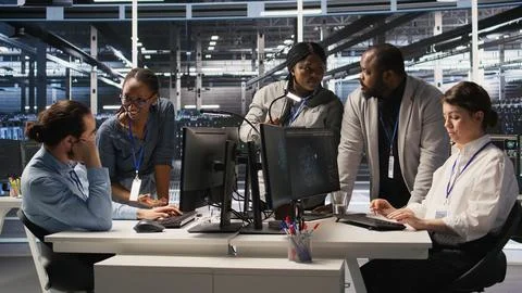 Engineering team in data center using AI automation Stock Photos