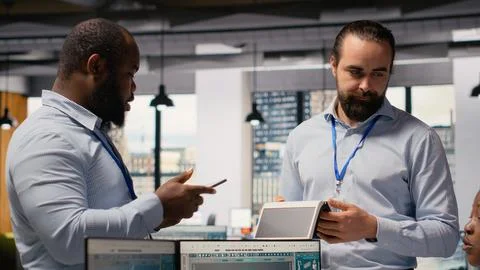Engineering team doing brainstorm, evaluating solar cell clean energy device Stock Photos