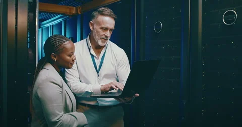 Engineering team, laptop and server room for cloud computing, programming and Stock Footage 261999180