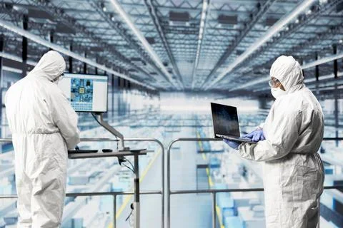 Engineering team in microchip factory using AI software to improve efficiency Stock Photos