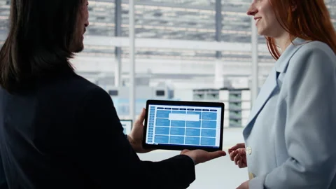 Engineering team modeling integrated circuit systems with tablet in RD office 動画素材 335880578