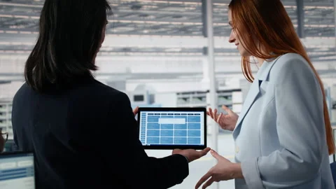 Engineering team modeling integrated circuit systems with tablet in RD office 動画素材 335882522