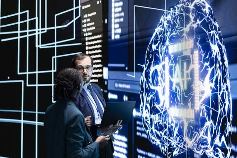 Engineering team observing rapid development of AI technology, brainstorming Foto stock