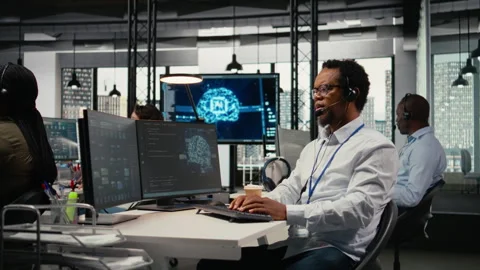 Engineering team in office providing remote diagnostics Stock Footage 323144123