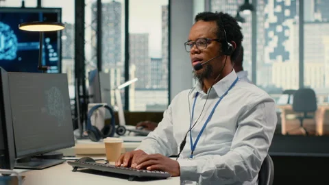 Engineering team in office providing remote diagnostics Stock Footage 323406694