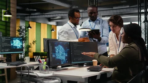 Engineering team in office using AI to optimize company systems 스톡 동영상 323143794