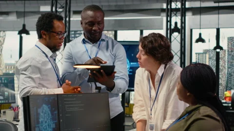 Engineering team in office using AI to optimize company systems 스톡 동영상 323407404