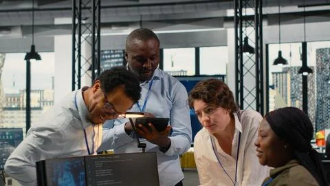 Engineering team in office using AI to optimize company systems Foto stock