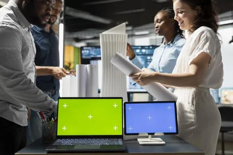 Engineering team reviews structural 3D models with copy space displays Stock Photos