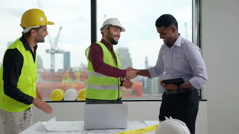 Engineering team shakes hands, congratulating them to work together Stock Footage 241322684