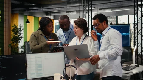 Engineering team in startup office working with AI technology Stock Footage 323032346