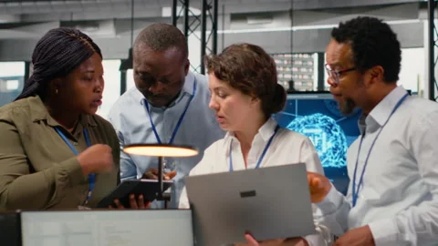 Engineering team in startup office working with AI technology Stock Footage 323238636