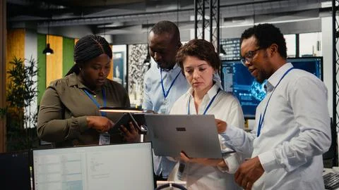 Engineering team in startup office working with AI technology Stock Photos