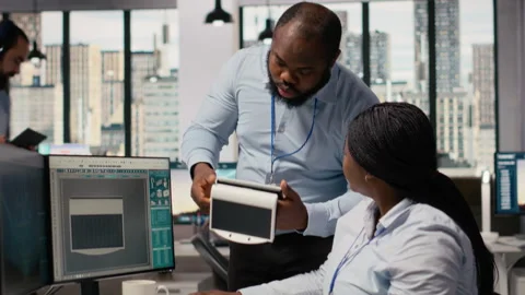 Engineering team turn on lights on portable solar energy gadget, testing battery Stock Footage 316004755