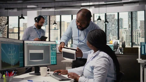 Engineering team turn on lights on portable solar energy gadget, testing battery Stock Footage 316006444