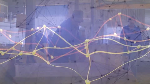 Engineering team unpacking blueprints placing tablet showing network graph 動画素材 311585974