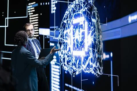 Engineering team use laptop to limit AI autonomy, brainstorming 스톡 사진