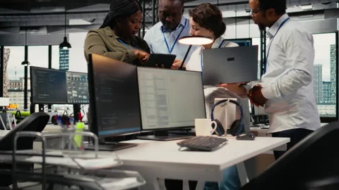 Engineering team working in AI startup training predictive models Stock Footage 323143762