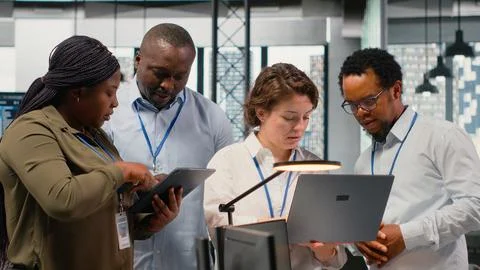 Engineering team working in AI startup training predictive models Stock Photos