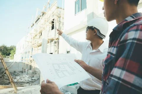 The engineering team working at building site meeting and discussing. Stock Illustration