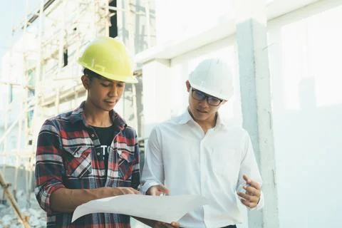 The engineering team working at building site meeting and discussing. Stock Photos