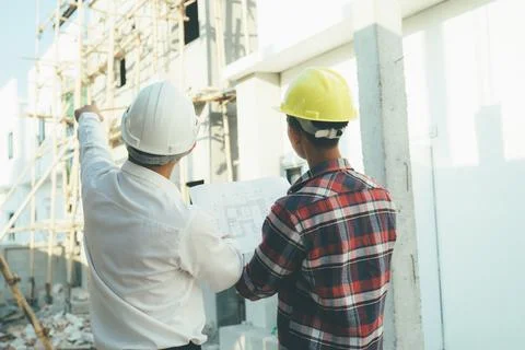 The engineering team working at building site meeting and discussing. Stock Photos