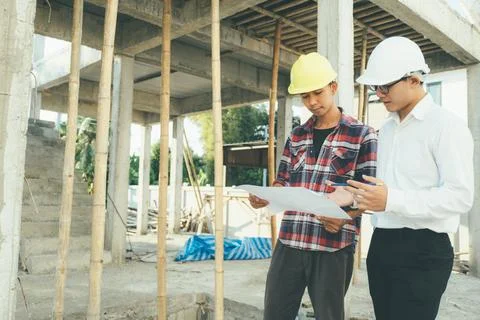 The engineering team working at building site meeting and discussing. Stock Photos