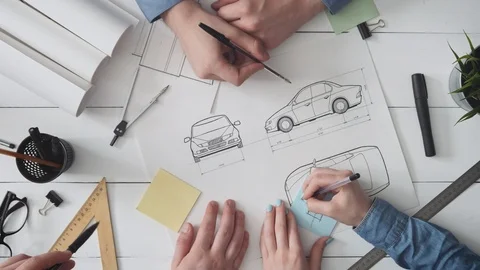 Engineering team working on a new automobile design Stock Footage 93889099