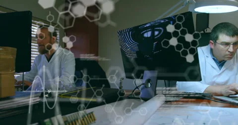 Engineering team working on schematics and activating code overlay while streams Stock Footage 309683154