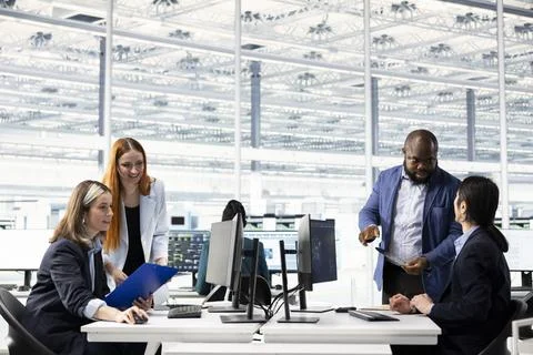 Engineering team working together in microchip factory RD office, training AI Stock Photos