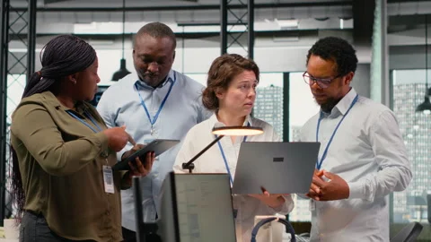 Engineering team working together in office, using AI specialized hardware Stock Footage 323144010