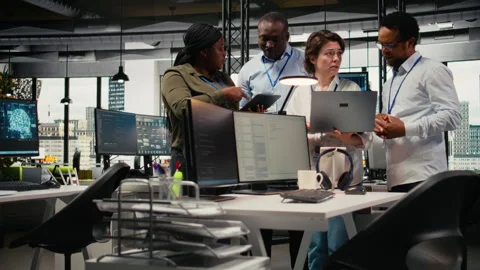 Engineering team working together in office, using AI specialized hardware Stock Footage 323144079